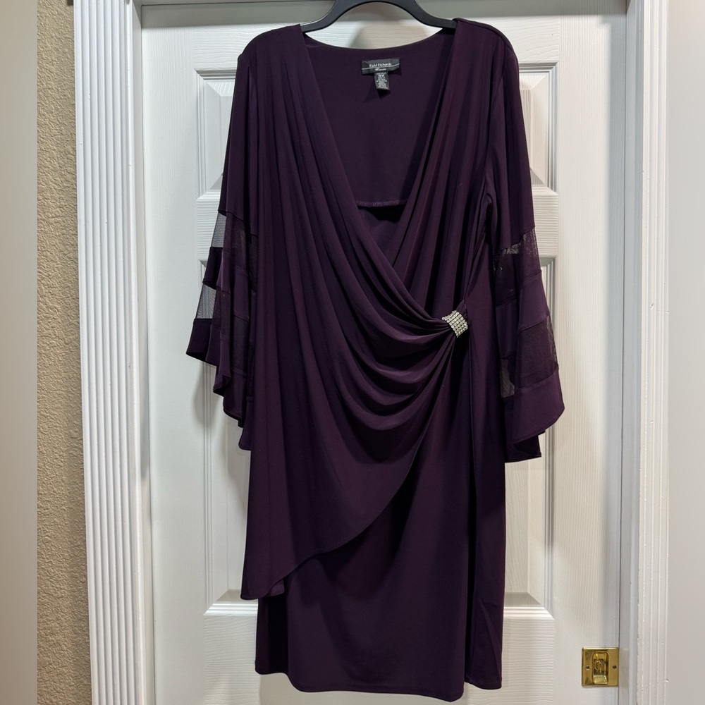 Beautiful faux wrap dress with bell sleeves. Sleeves have sheer panels